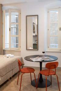Postel nebo postele na pokoji v ubytování PIAC Luxury Suites