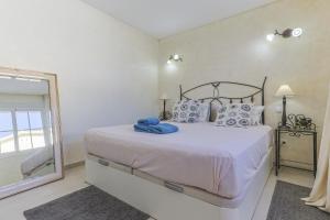 Posteľ alebo postele v izbe v ubytovaní La Casa Blanca