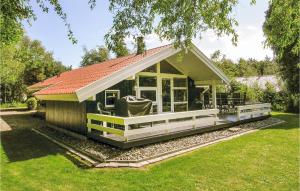 a small cottage with a red roof at Holiday Home Humble 34 With Hot Tub in Humble