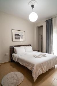 Giường trong phòng chung tại Feel Greek Hospitality #Θ012