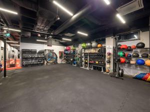 a large room with a gym with a bunch of balls at Novotel Gdańsk Marina in Gdańsk