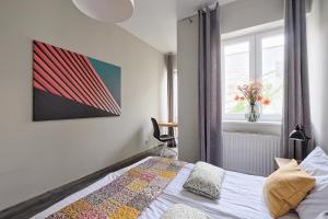 Posteľ alebo postele v izbe v ubytovaní Urban Nest Apartments Radziwiłłowska 14