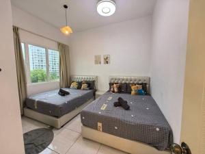 a bedroom with two beds and a window at Japanese Style Suite 9Pax Alston & Amber in Kuah +114 photos