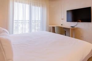 Postel nebo postele na pokoji v ubytování Hotel HOGO + 37 fotografií