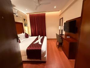 Postel nebo postele na pokoji v ubytování Park Avenue Hotel & Apartments Trichy