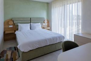 Hotel HOGO客房内的一张或多张床位