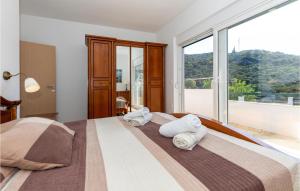 Posteľ alebo postele v izbe v ubytovaní Two-Bedroom Holiday Home In Ploce