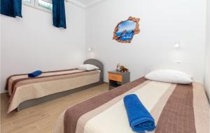 Posteľ alebo postele v izbe v ubytovaní Two-Bedroom Holiday Home In Ploce