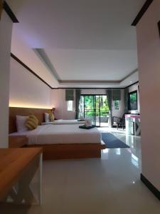 Postel nebo postele na pokoji v ubytování Khaolak Yama Resort - SHA Plus + 37 fotografií