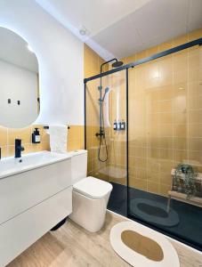 a bathroom with a shower and a toilet and a sink at San Basilio in Murcia
