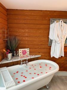 a bathroom with a bath tub with hearts on it at Kaoglen Doe-Feature Bathroom-Cairngorms-Pets Allowed in Balnald