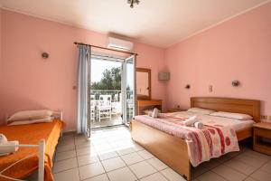 Postel nebo postele na pokoji v ubytování Helena Inn
