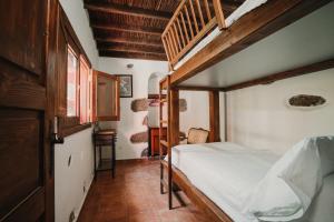 Posteľ alebo postele v izbe v ubytovaní Rural Suite Santiago de Tunte