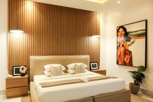 Postel nebo postele na pokoji v ubytování George Residence Cooper Road, Ikoyi