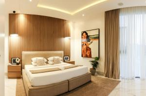 Postel nebo postele na pokoji v ubytování George Residence Cooper Road, Ikoyi