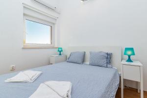 Ένα ή περισσότερα κρεβάτια σε δωμάτιο στο Apartment Robi 1