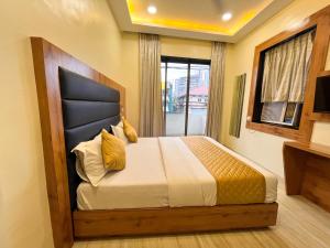 Postel nebo postele na pokoji v ubytování Hotel National - Grant Road