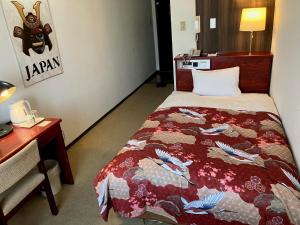 Postel nebo postele na pokoji v ubytování Sky Heart Hotel Koiwa