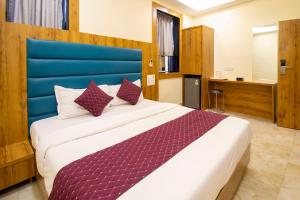Postel nebo postele na pokoji v ubytování Hotel National - Grant Road