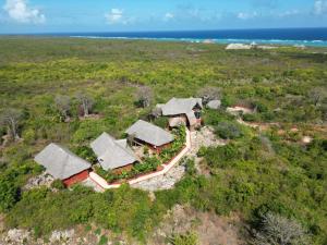 an aerial view of a house on a beach at MONKEY MOUNTAIN LODGE in Mtende