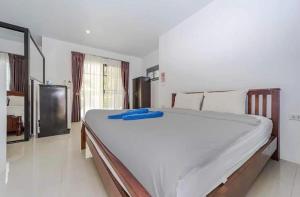 a bedroom with a large white bed in a room at Share pool 1 room 2 bedroom in Ao Nang 