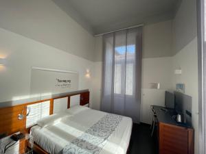 Postel nebo postele na pokoji v ubytování Hotel Europa Varese