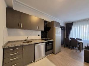 Kuchyň nebo kuchyňský kout v ubytování The U HOMES APART