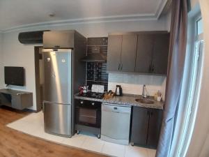 Kuchyň nebo kuchyňský kout v ubytování The U HOMES APART