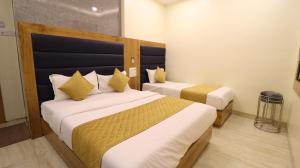 Postel nebo postele na pokoji v ubytování Hotel National - Grant Road