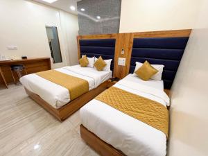 Postel nebo postele na pokoji v ubytování Hotel National - Grant Road