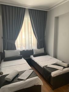 Postel nebo postele na pokoji v ubytování The U HOMES APART