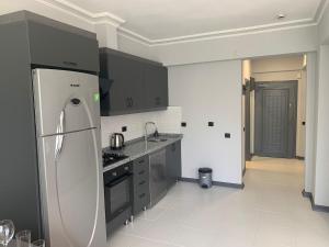 Kuchyň nebo kuchyňský kout v ubytování The U HOMES APART