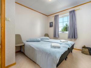 Postel nebo postele na pokoji v ubytování Chalet Seievika by Interhome