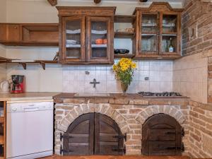 a kitchen with a brick oven and a sink at Apartment Lea-1 by Interhome in Pazin