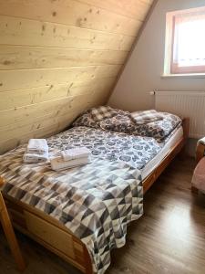 Postel nebo postele na pokoji v ubytování U kowalczyków