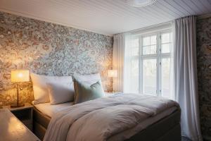 Postel nebo postele na pokoji v ubytování Nusfjord Village & Resort