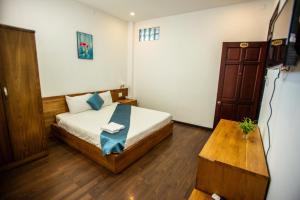 Postel nebo postele na pokoji v ubytování Thanh Thanh Spa & Hotel