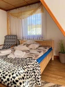 Postel nebo postele na pokoji v ubytování U kowalczyków