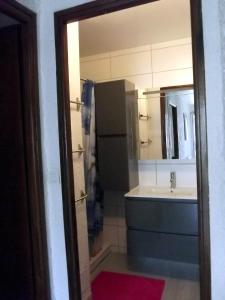 a bathroom with a sink and a sink at Côté Montagne in Orcières