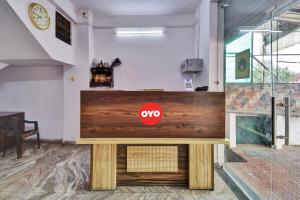 a counter with aoops sign on it in a room at Hotel O HM & Restaurant in Begās