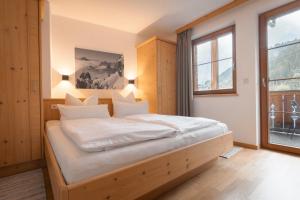 Posteľ alebo postele v izbe v ubytovaní Apartments SARLO
