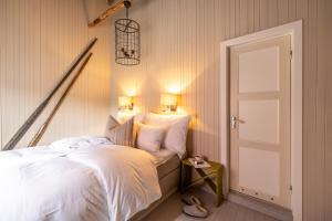 Postel nebo postele na pokoji v ubytování Nusfjord Village & Resort