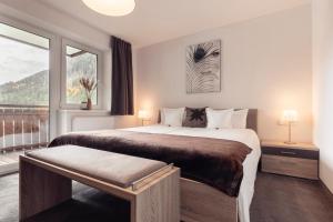 Posteľ alebo postele v izbe v ubytovaní Alpen-Appartements Zürcher