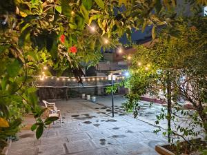 a garden with a string of lights in a building at Garden Villa, Hyderabad in Hyderabad