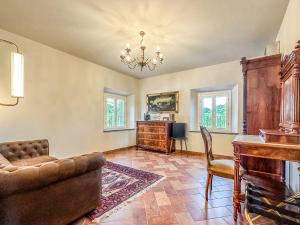 a living room with a couch and a desk at Villa Naldi Relais in San Carlo