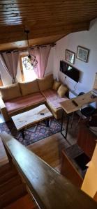 a living room with a couch and a table at Viktory II in Vlasic