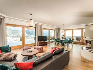 a living room with a couch and a table at Apartment Panorama Dachstein by Interhome in Rohrmoos