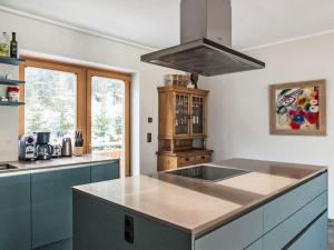a kitchen with a sink and a stove at Apartment Panorama Dachstein by Interhome in Rohrmoos +17 photos