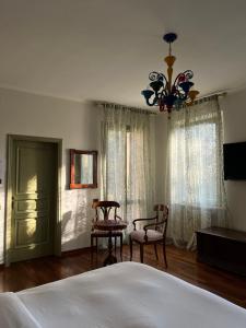 Una cama o camas en una habitación de Locanda San Martino