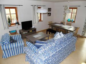 a living room with two couches and a table at Ferienhof Idyll am kleinen Fließ in Burg